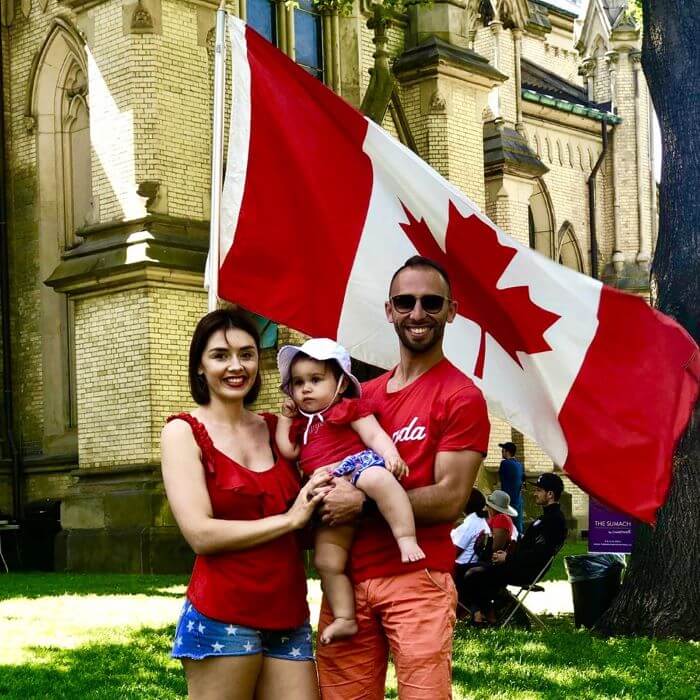 GTA Direct CEO with family next to a Canadian flag